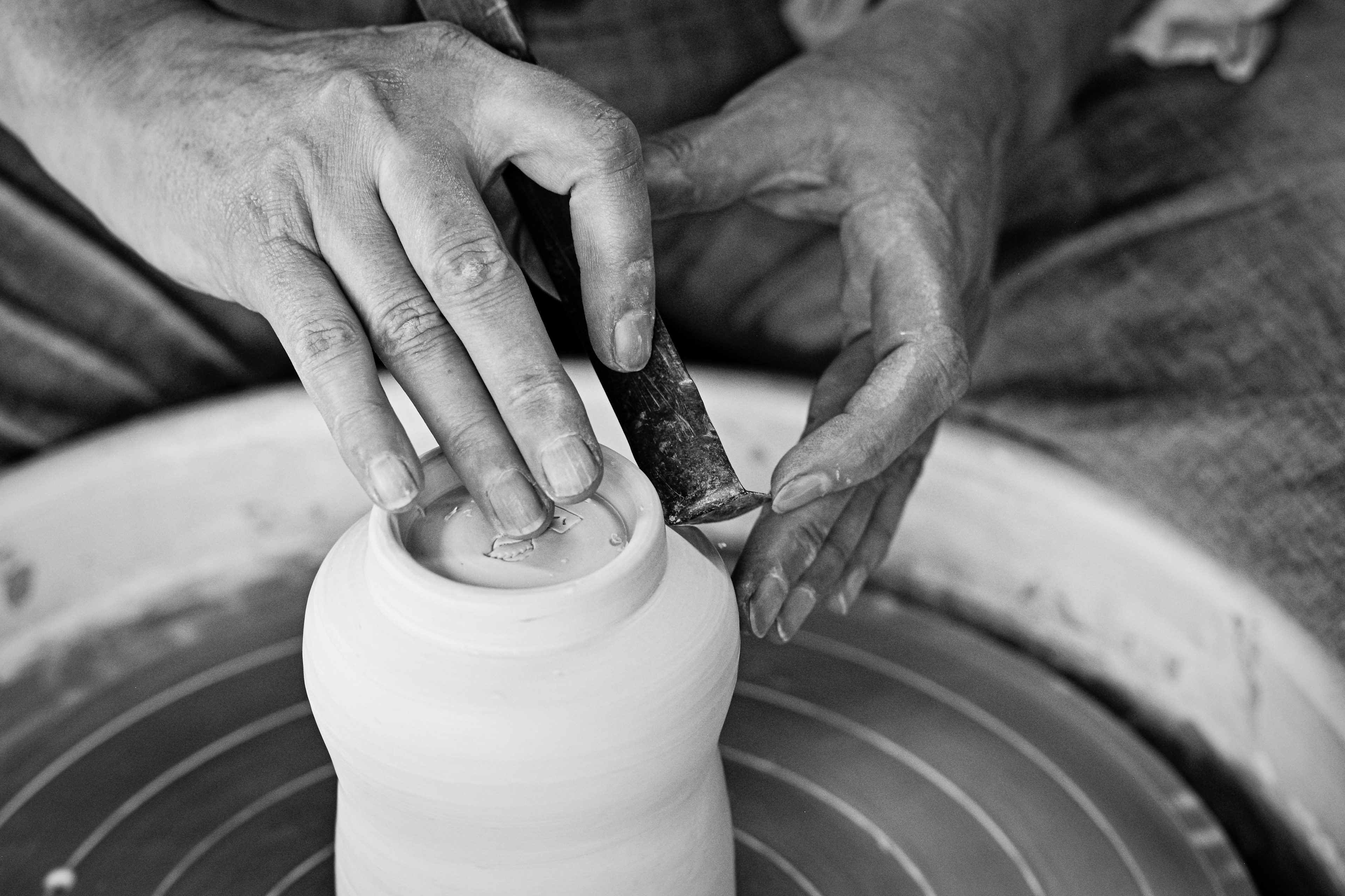 Potter shaping clay by hand