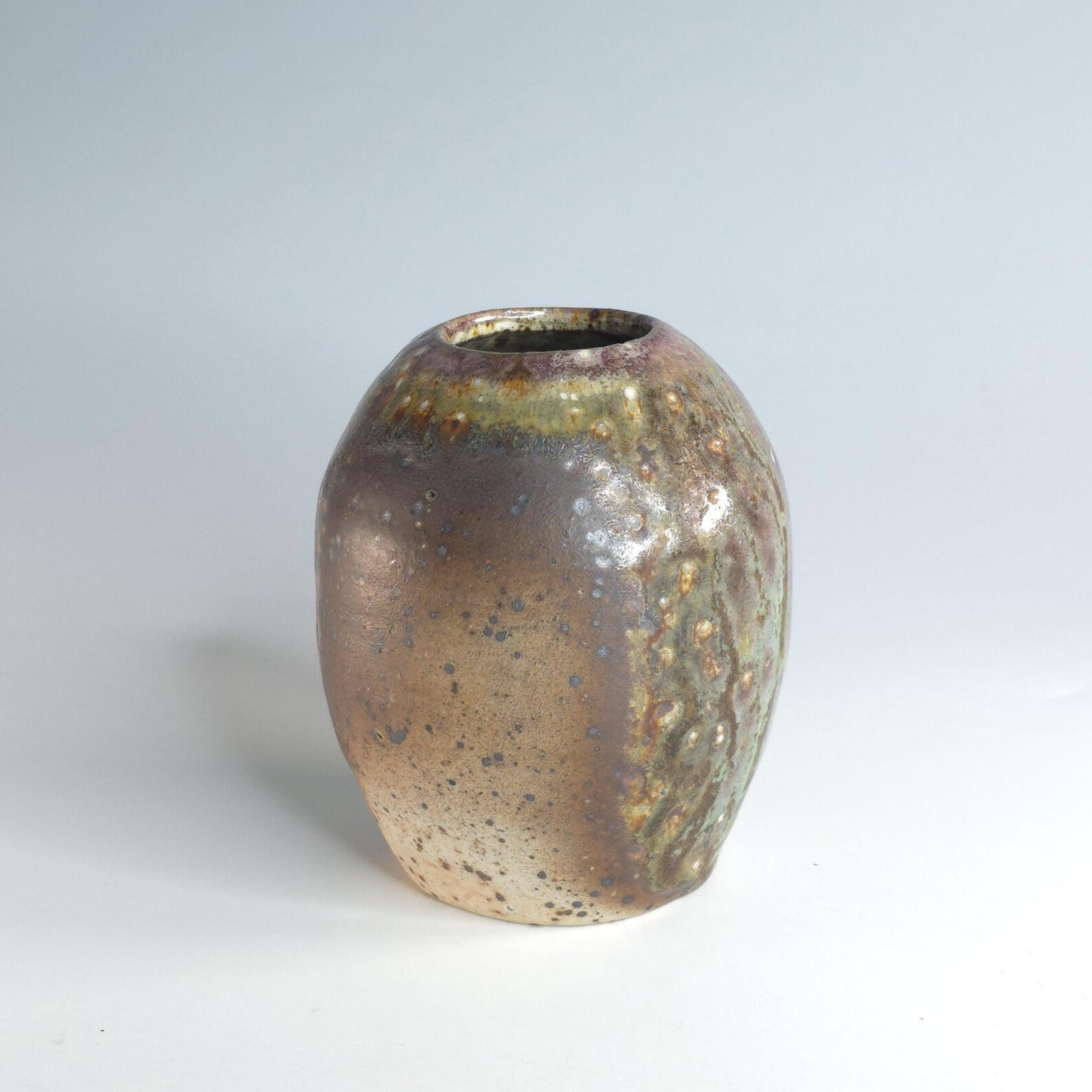 Soda-fired ceramic vase with copper glaze, fired to cone 10