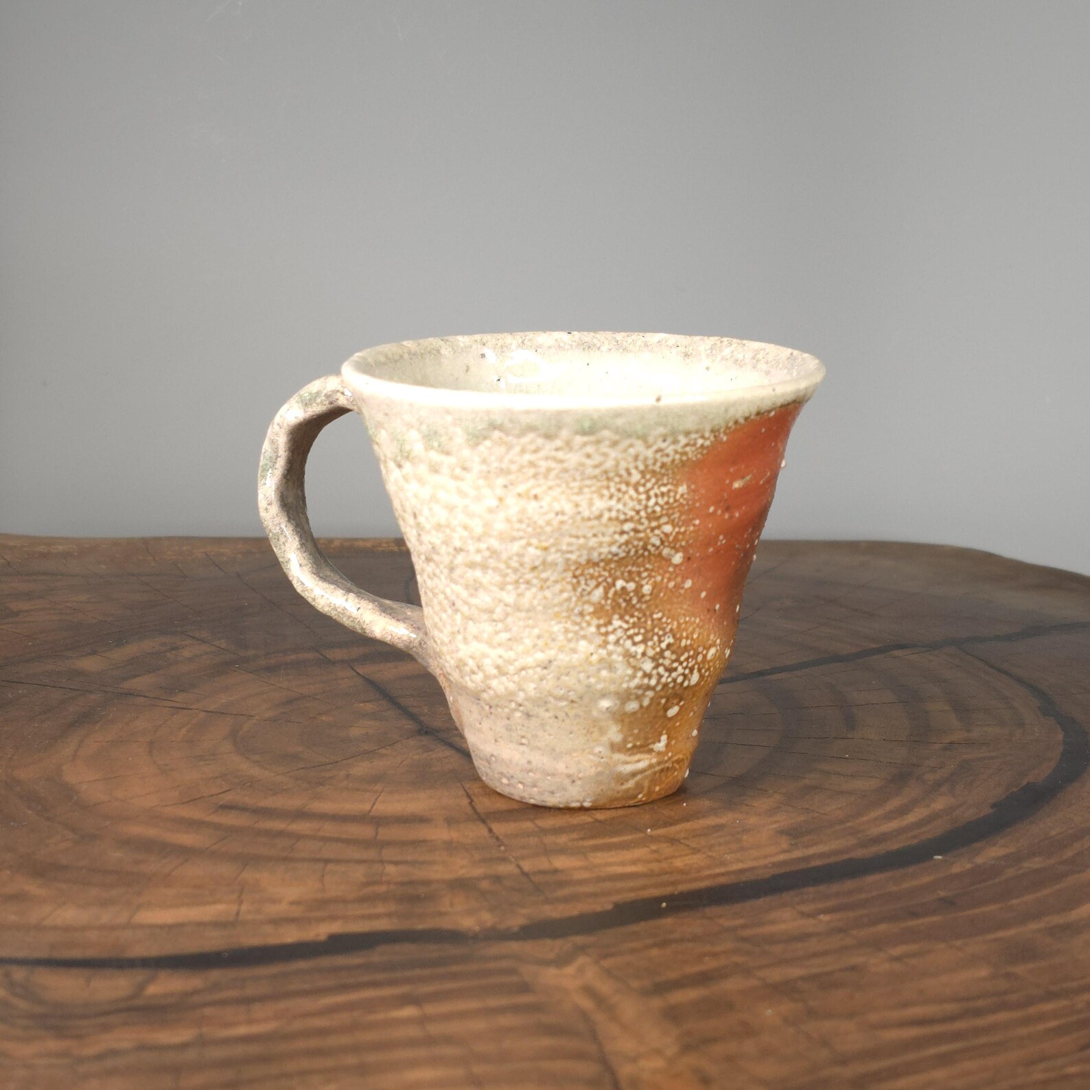 Soda-fired ceramic espresso cup with handle