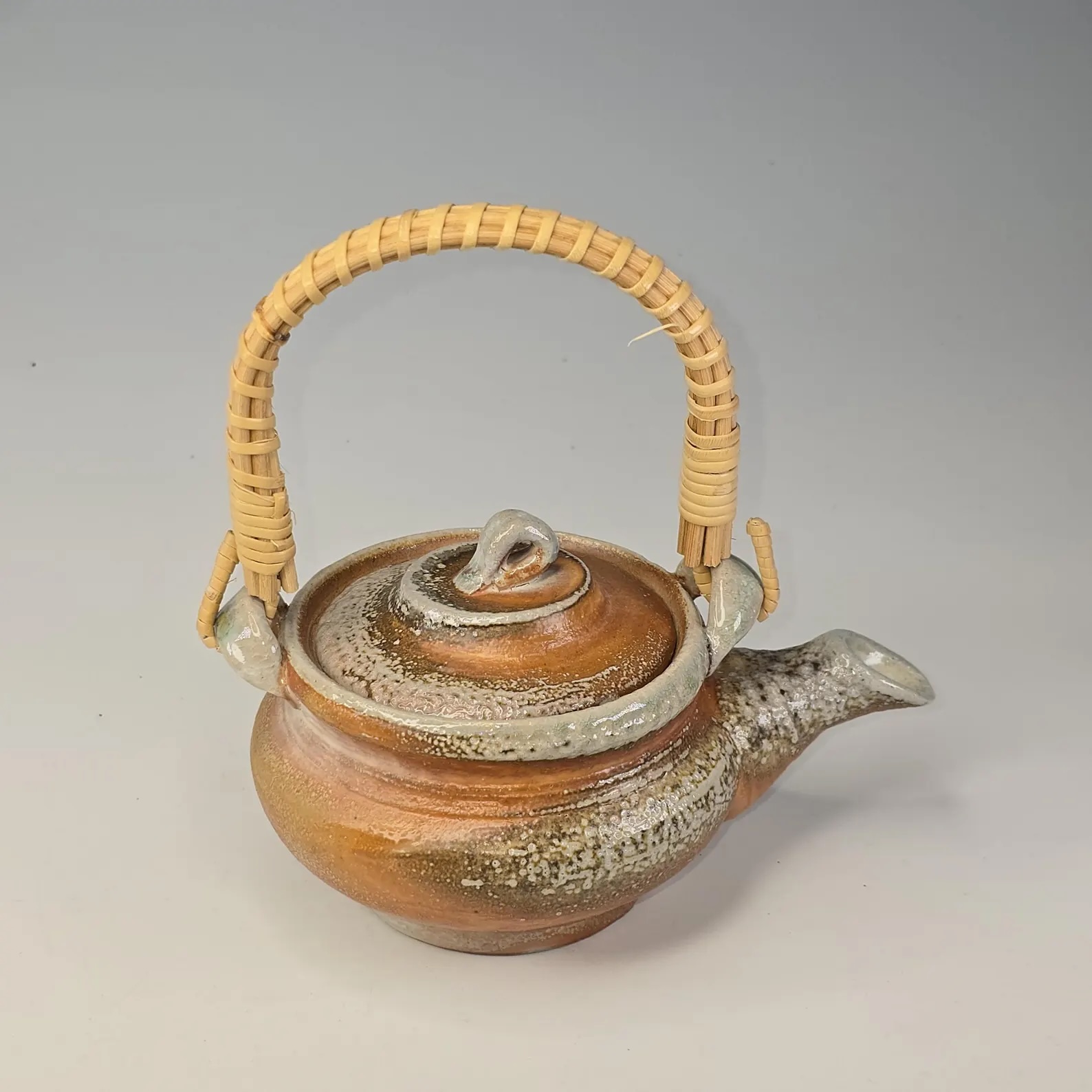 Soda-fired Japanese dobin teapot with a woven bamboo handle