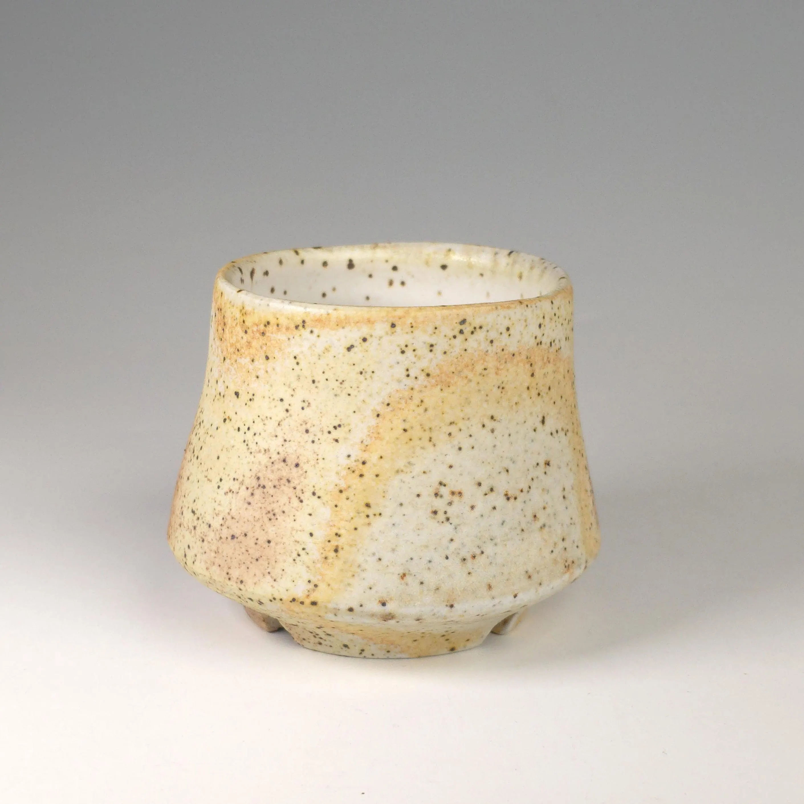 Soda-fired Japanese-style ceramic teacup in yellow