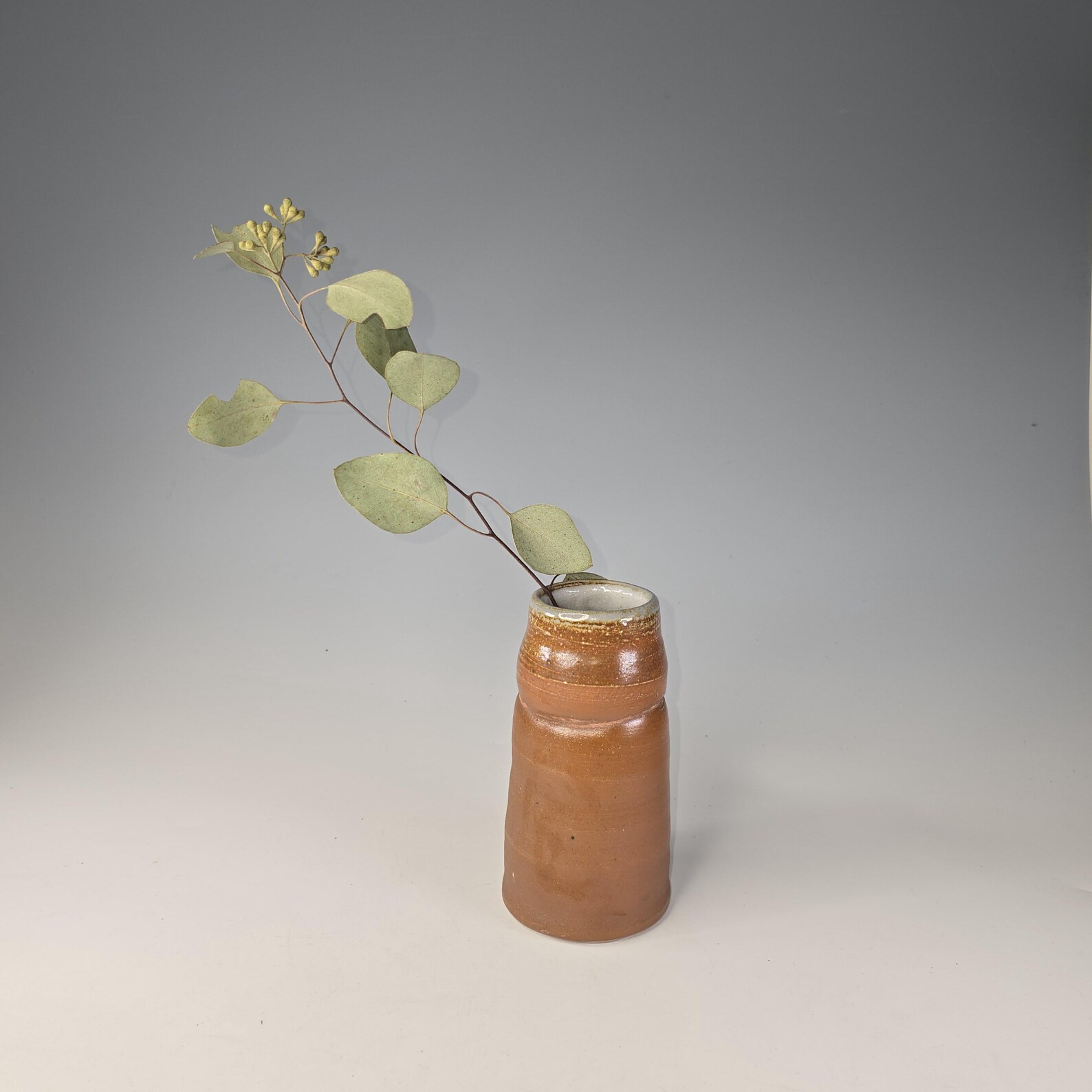 Wood- and soda-fired ceramic vase with organic rope texture